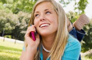 teenage-girl-talking-on-her-mobile-phone